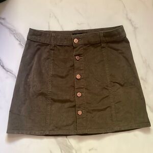 LIKE NEW - Dark army green mini skirts, with five bronze buttons. Size is 5/27.